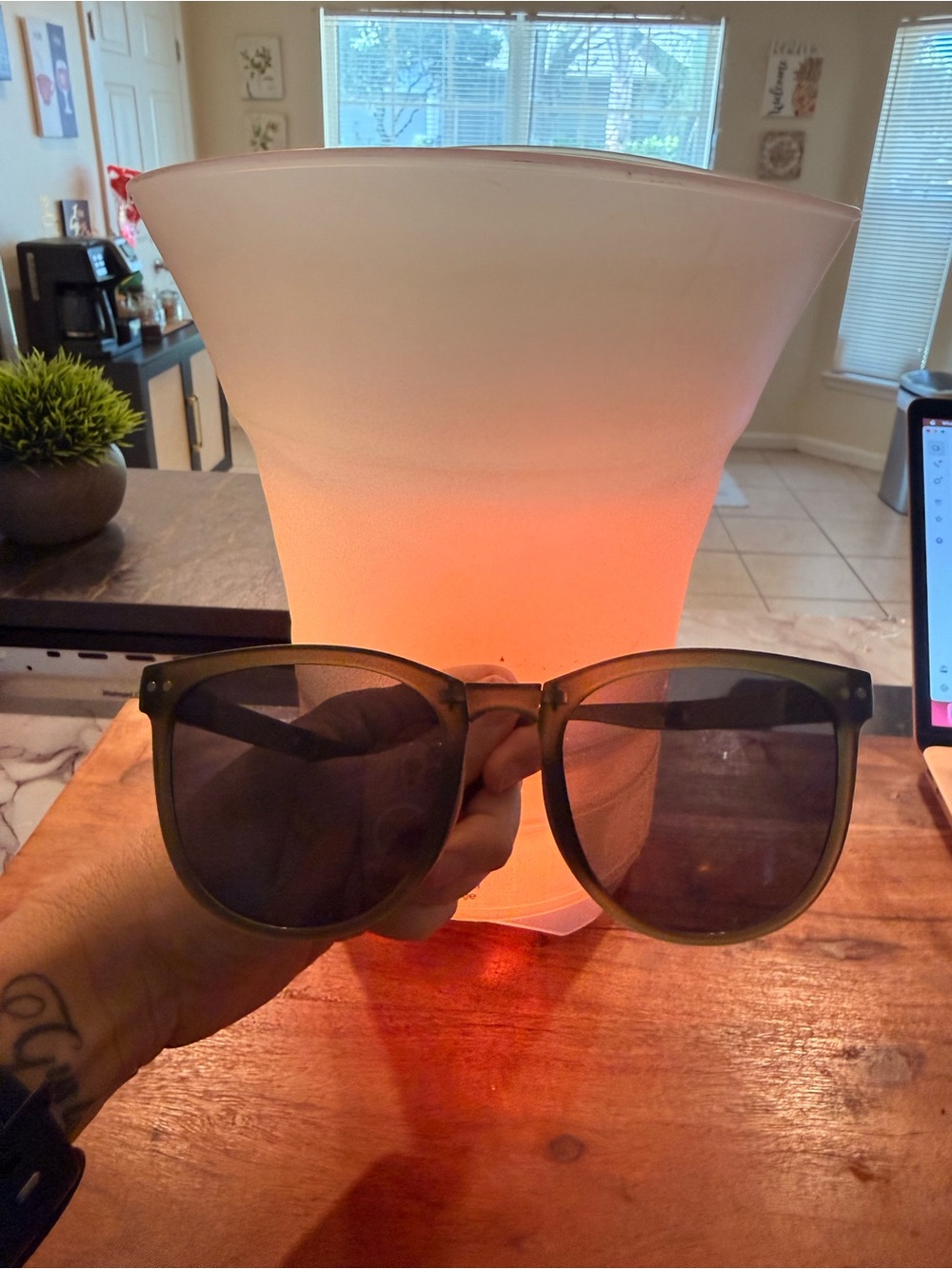 Green sunglasses with black lenses